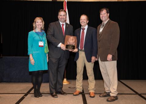 The winner of the C.W. Watson award poses with the SEAFWA president and the Award Committee members