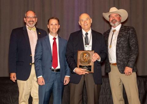 Rober Warren receiving the SEAFWA Watson Award 2023