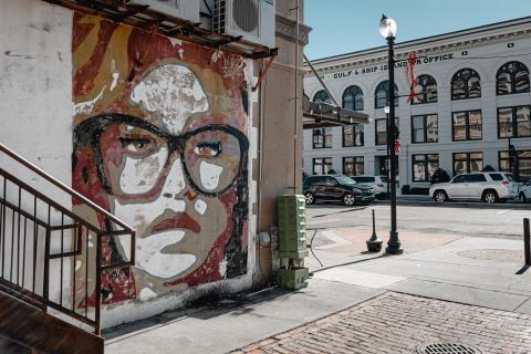Mural of a girl with glasses in downtown Mississippi