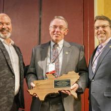 J.D. Strong, Director, Oklahoma Department of Wildlife Conservation; Paul Johansen, Award Recipient; Eric Sutton, President, SEAFWA